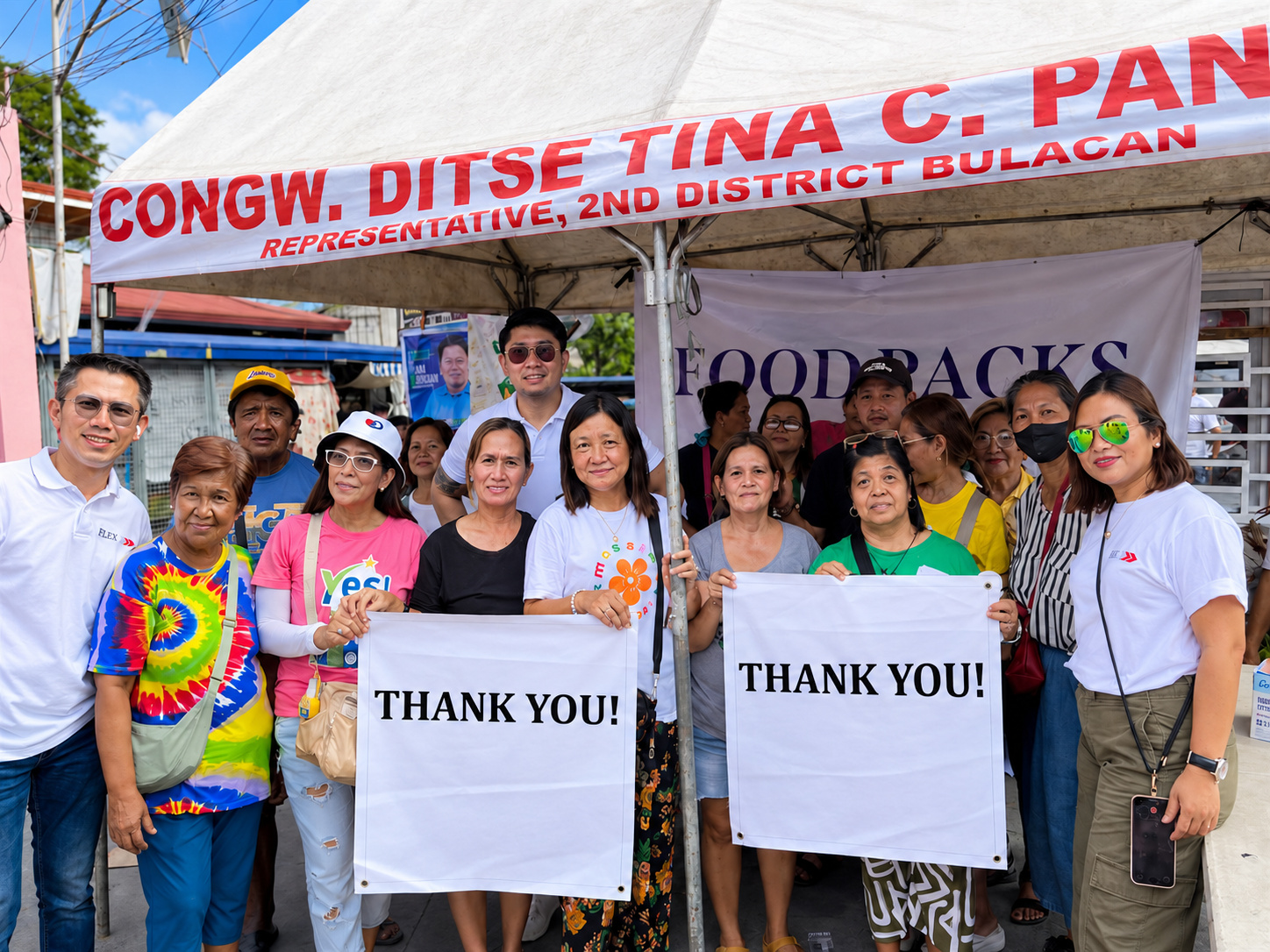 Community leaders and the Flex team together at a distribution event